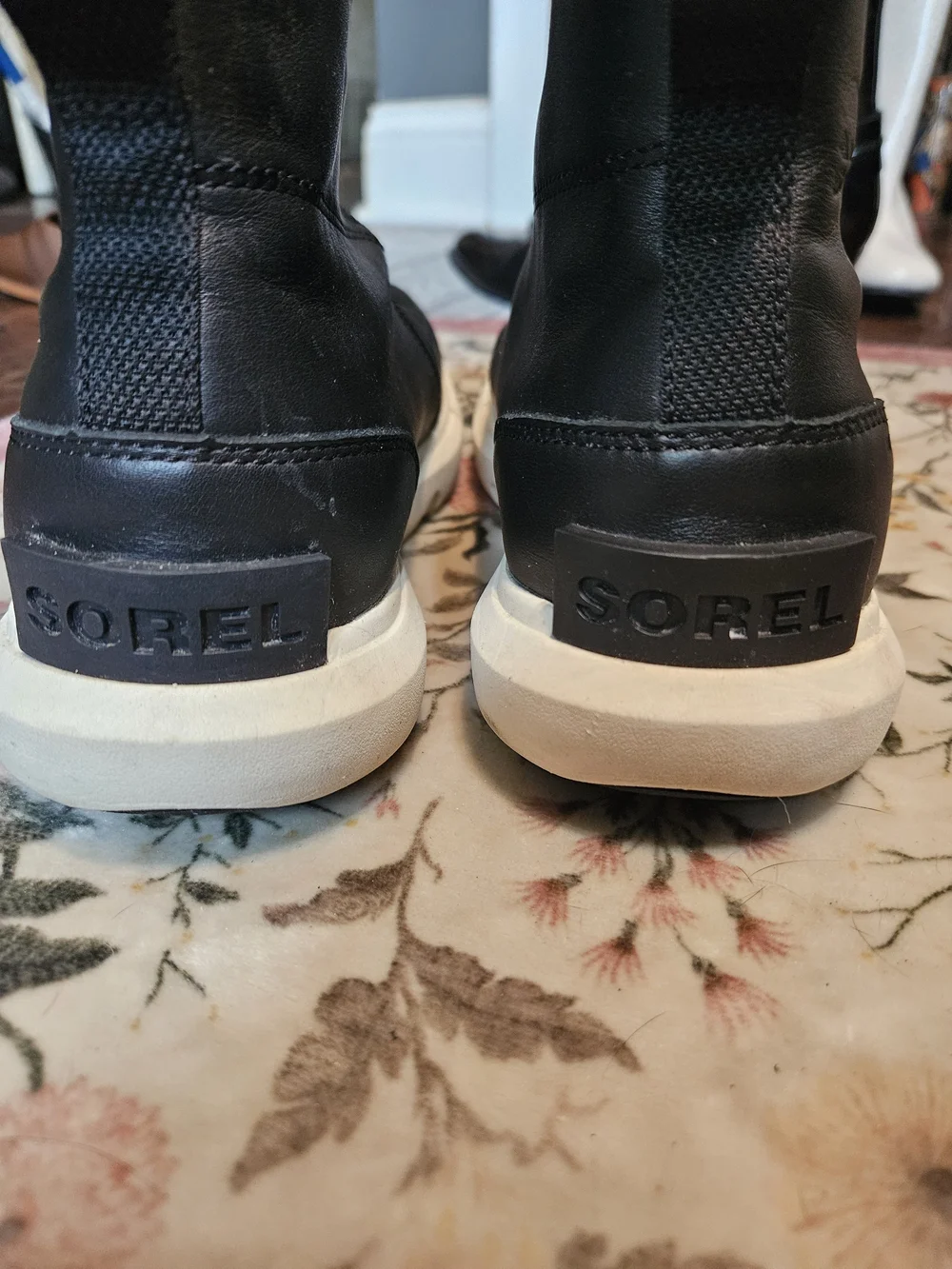 Sorel Black and White Slip-On Zip Ankle Boots for Women